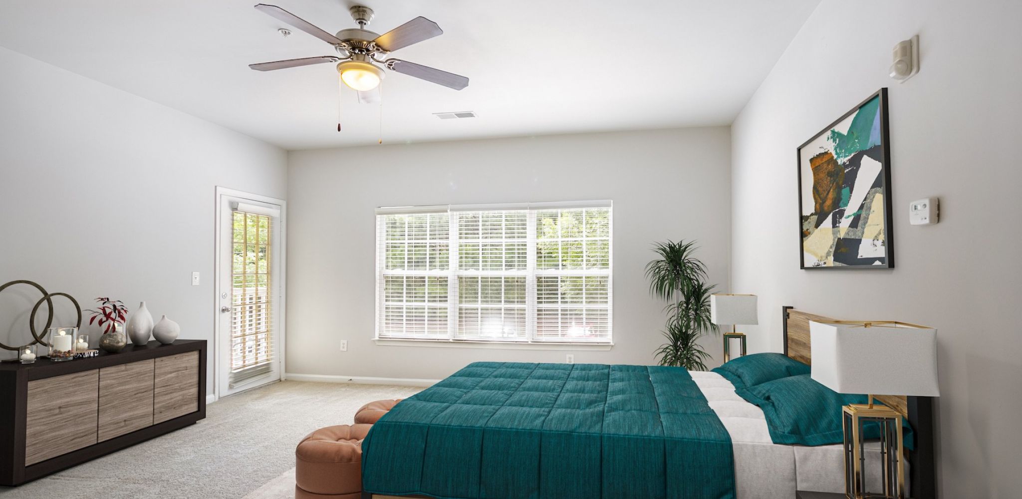 Hawthorne at Mirror Lake spacious apartment bedroom with carpet and large windows and furnished with large bed