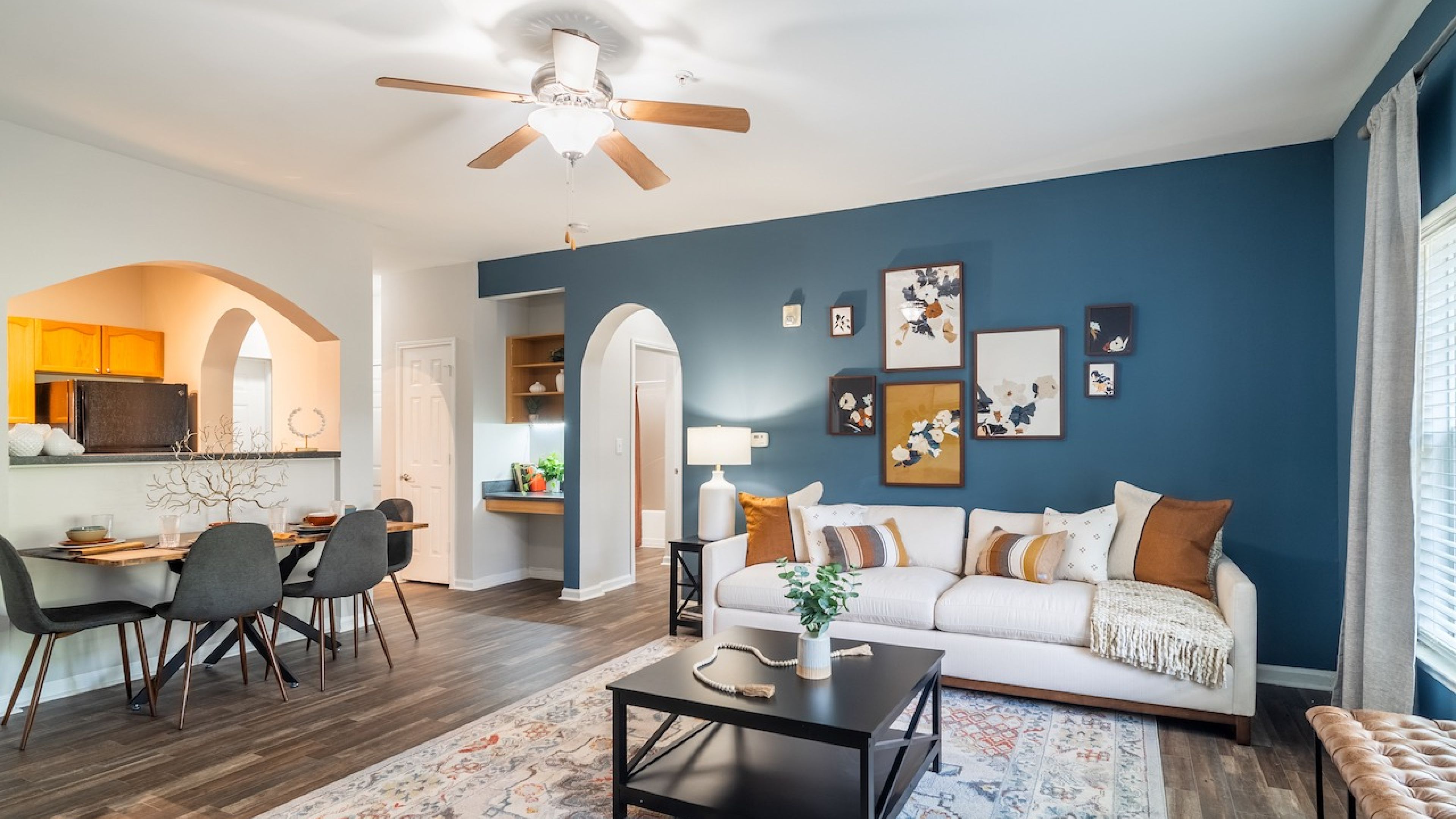 Hawthorne at Mirror Lake apartment interior showing dining area, dining table, and living with couch and coffee table